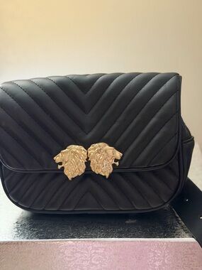 Black Quilted Women’s Belt Bag with Gold Lion Accent